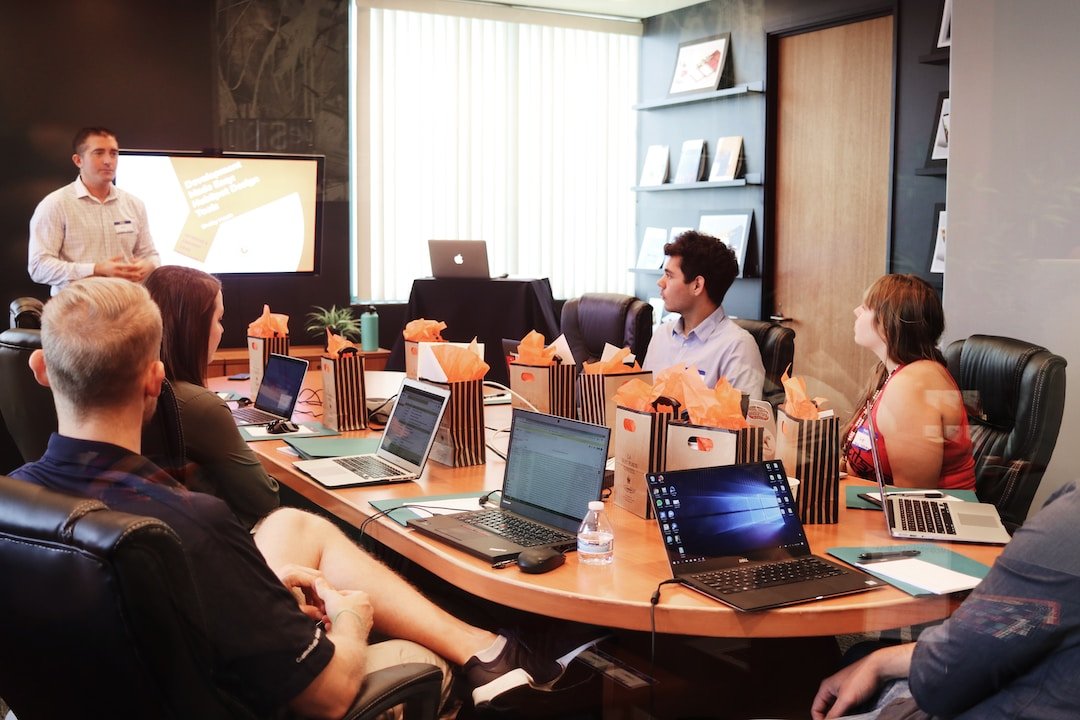 Conference room where businessman is discussing benefits of professional services automation with coworkers