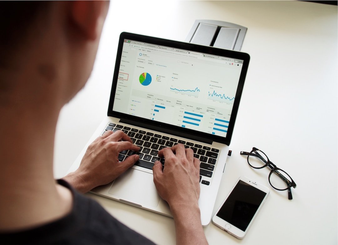 Employee using a laptop to go over business data and create treemap chart examples